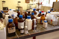 chemical bottles on a laboratory table