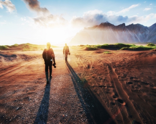 Fantastic west of the mountains and volcanic lava sand dunes to the beach Stokksness. Tourists traveling through the wilderness