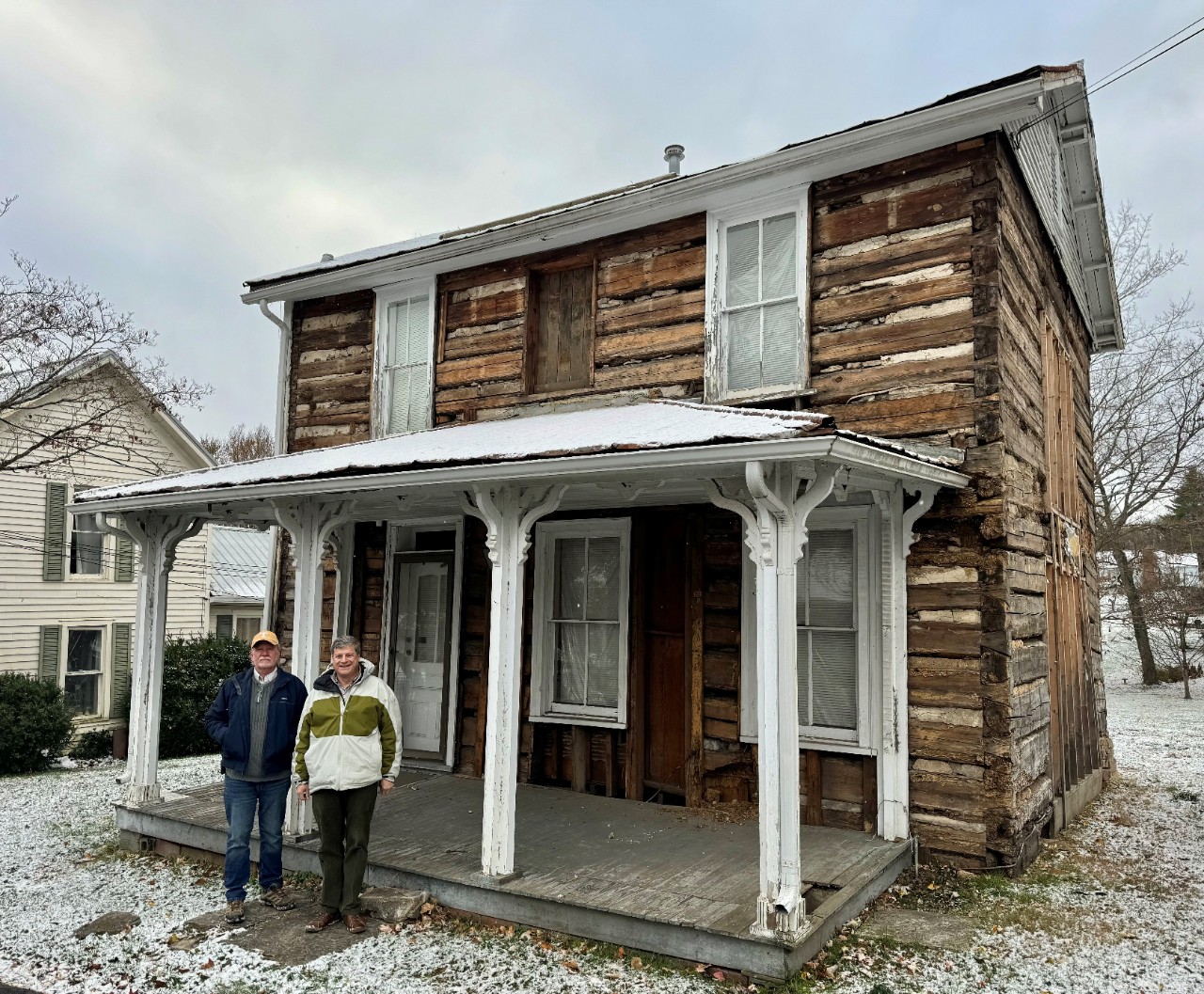 McIntyre with Steve Nelson of the Rogersville Heritage Association at the c. 1800 Rogers Tavern in Rogersville, December, 2024. The tavern is receiving a $100,000 HPFLAF grant from the THC.