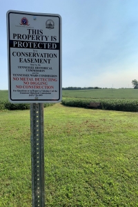 Tennessee Wars Commission Conservation Easement sign in a field TWC Easement Sign