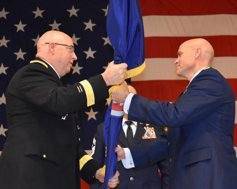 Maj. Gen. Max Haston, (left), the Adjutant General of the Tennessee National Guard, passes the guidon to Col. Jason Glass (right), symbolizing his assumption of command as the newly assigned Assistant Adjutant General for the Tennessee Air National Guard on Jan. 7 at the Tennessee National Guard Joint Force Headquarters in Nashville, Tenn. (Tenn. National Guard photo by Master Sgt. Robin Brown)