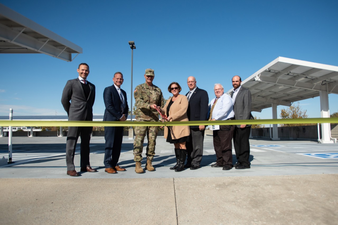 :  (L to R), Adam Glod, SLS Energy Solutions, Richard Hunter, SLS Energy Solutions, Maj. Gen. Jeff Holmes, Tennessee’s Adjutant General, Kathy Glapa, Tenn. Dept. of Environment and Conservation, Todd Smith, SLS Energy Solutions, Danny Brown, Energy Manager for the Tenn. Army National Guard and Chris Koczaja, President of Lightwave Solar cut a “GREEN” ribbon at the unveiling of a state-of-the-art Solar Photovoltaic system at the Joint Force Headquarters