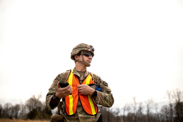 Image of a Soldier with 2nd Squadron, 278th Armored Cavalry Regiment, using a communication device operating on FirstNet