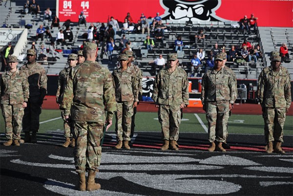 Tennessee’s Deputy Adjutant General, Maj. Gen. Jimmie Cole, swore in 18 of Austin Peay State University’s ROTC cadets during their military appreciation football game at Fortera Stadium on Nov. 6. (Photo by Sgt. James Bolen Jr.)   