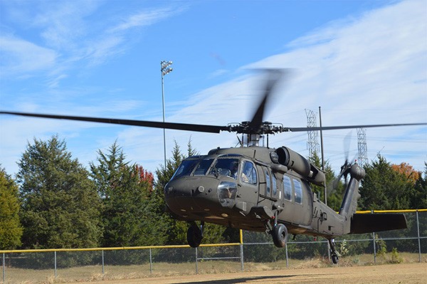 A UH-60 Blackhawk helicopter with Jackson’s 1-230th Assault Helicopter Battalion lands at the Cordova High School’s baseball field on Nov. 18. Students and teachers were able to get first hand exposure to Blackhawks during an educator’s flight organized by the Tennessee Army National Guard. (Photo by Sgt. Finis L. Dailey, III)