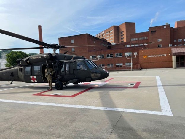 A Tennessee Army National Guard medical flight crew responded to an emergency air evacuation mission after a hiker has difficulty breathing while on the Appalachian Trail, May 9. The flight crew successfully transported the patient to the University of Tennessee Medical Center in Knoxville. (Courtesy Photo from the Tennessee National Guard) Army Helicopter on helipad of UT Trauma Center in Knoxville