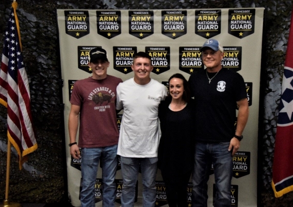 Pfc. Brandon Morehead poses with his brother, mother, and father after he swears in to the Tennessee Army National Guard at the Smyrna Bowling Center on July 23. (Photo by Sgt. James Bolen) Pfc. Brandon Morehead poses with his brother, mother, and father after he swears in to the Tennessee Army National Guard at the Smyrna Bowling Center on July 23. (Photo by Sgt. James Bolen)