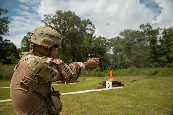 A member of the Tennessee National Guard fires an M17 pistol, Aug. 20, during the TAG Pistol Match at Tullahoma’s Volunteer Training Site. The TAG Match is an annual marksmanship competition and training event hosted by the Tennessee Combat Marksmanship Program. (Photo by Pfc. Olivia Gum)