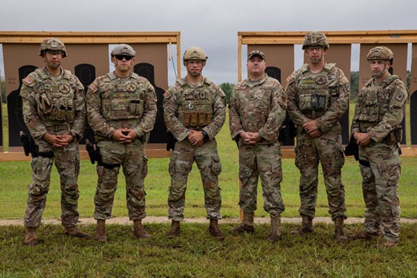 (Left to right) Staff Sgt. Alfonso Villegas, Staff Sgt. Justin Mabe, Capt. Andrew Hahn, Master Sgt. Michael Brumer, Staff Sgt. Thomas Burns, and Staff Sgt. Brandon Hughes pose for a photo at the TAG Pistol Match, Aug. 22, at Tullahoma’s Volunteer Training Site. Brumer, Tennessee’s state marksmanship coordinator, invited the group of five Active Army personnel from Fort Leonard Wood, Missouri, to take part in the Tennessee National Guard’s annual training event. (Photo by Pfc. Olivia Gum)