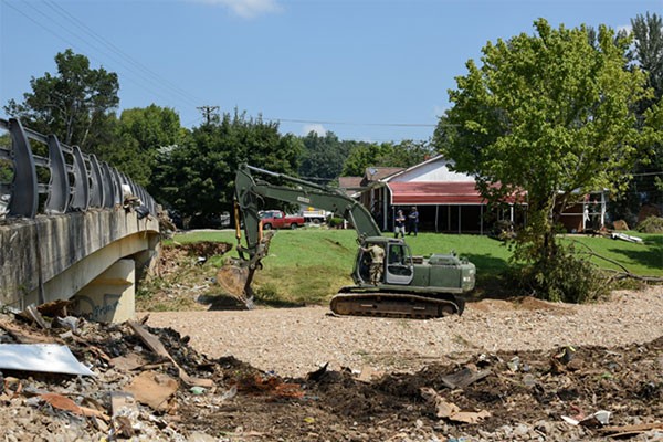 Soldiers and Airmen from the Tennessee National Guard conduct cleanup operations in Waverly, Aug. 26, following deadly flooding last weekend. More than 80 members of the Tennessee National Guard are in Humphreys County working with state, county, and local emergency personnel, as well as the Tennessee Emergency Management Agency, assisting with traffic control, security, supply distribution, and cleanup operations in the impacted area. (Photo by retired Sgt. 1st Class Edgar Castro)