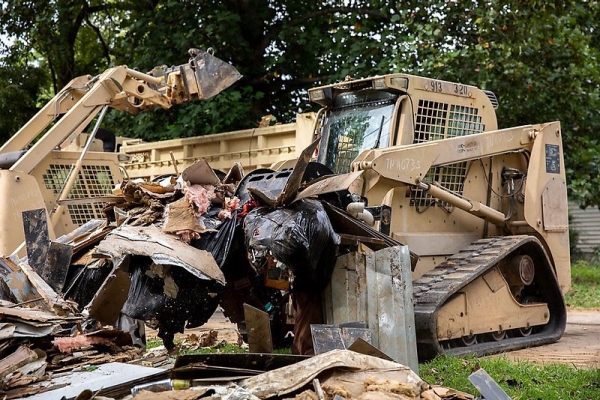 Soldiers from the 230th Engineer Battalion remove debris in Waverly, September 9th. More than 17 inches of rain caused flash floods that ravaged the Waverly community August 20th -21st.. (Photo by Staff Sgt. Timothy Cordeiro)