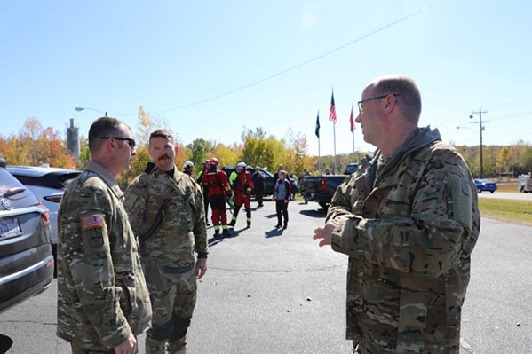 Flight crew from Tennessee National Guard’s 1-230th Air Assault Battalion gather with Humphreys County first responders after the joint search and rescue exercise, Oct. 19, on Kentucky Lake. (Photo by Capt. Kealy Moriarty)