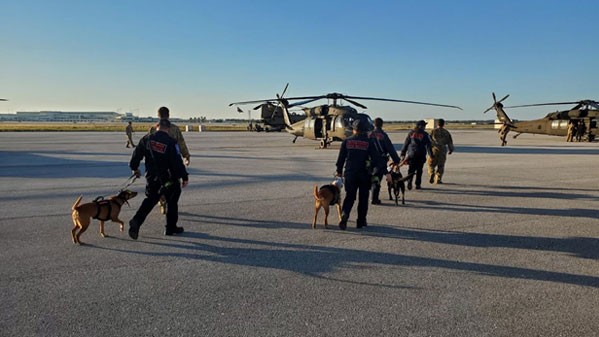 Crewmembers from the Tennessee National Guard’s 1-230th Assault Helicopter Battalion prepare to airlift K9 urban search and rescue teams to remote sites affected by Hurricane Ian. (Submitted photo)