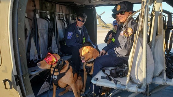 K9 urban search and rescue teams prepare to fly on a Blackhawk with the Tennessee National Guard’s 1-230th Assault Helicopter Battalion to remote sites affected by Hurricane Ian. (Submitted photo) 