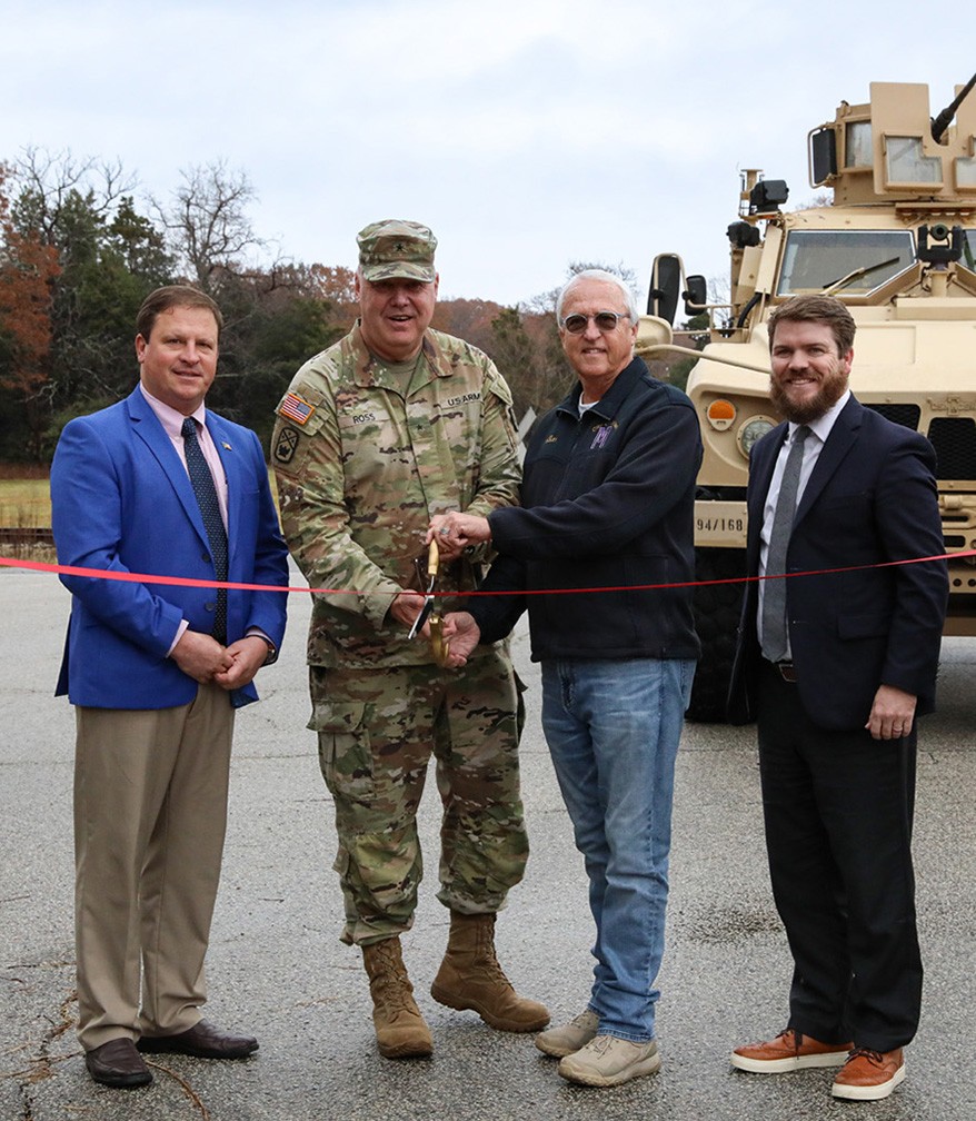 Gibson County Mayor Nelson Cunningham, Brig. Gen. Warner Ross, Tennessee’s Assistant Adjutant General-Army, Milan Mayor B.W. Beasley, and Carroll County Mayor Joseph Butler cut a ceremonial ribbon at the Milan Volunteer Training Site during a ceremony in Milan on Dec. 6. (photo by: Capt. Kealy Moriarty)  