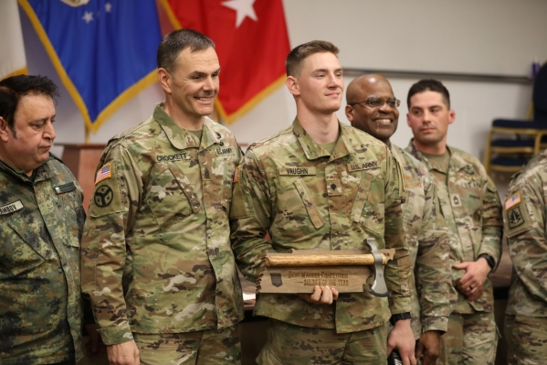 Spc. Grayson Vaughn, a member of the 252nd Military Police Company, poses for a photograph with Command Sgt. Maj. James Crockett, Command Sgt. Maj. for the Tennessee Army National Guard, after selected as Tennessee’s 2022 Soldier of the Year on Feb. 27. (Photo by Sgt. Finis Dailey)