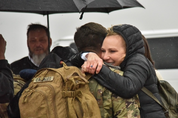 A Soldier with the Tennessee National Guard’s 1st Battalion, 181st Field Artillery Regiment, is greeted by a family member after arriving at Smyrna’s Volunteer Training Site, Feb. 3, following a successful 10-month deployment to the Middle East. (photo by Sgt. 1st Class Timothy Cordeiro)