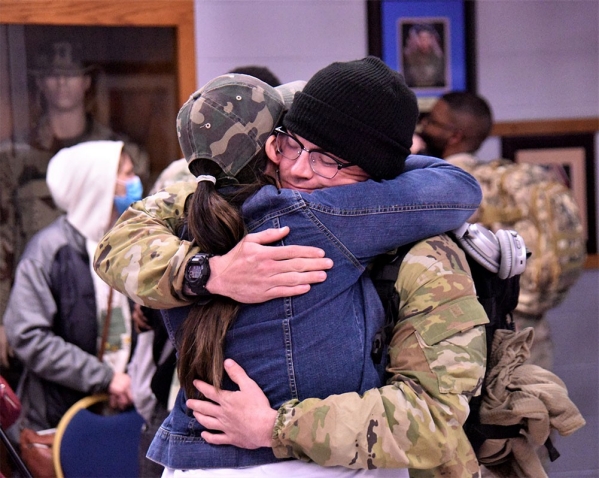 A Soldier with the Tennessee National Guard’s 1st Battalion, 181st Field Artillery Regiment, is greeted by his family after arriving at Smyrna’s Volunteer Training Site, Feb. 6, following a successful 10-month deployment to the Middle East. (photo by Lt. Col. Darrin Haas)