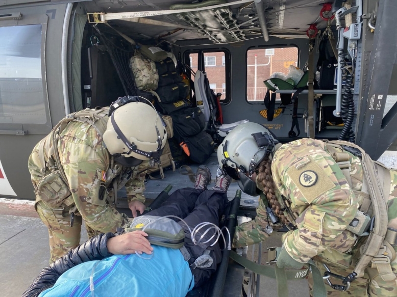 A Tennessee National Guard medical crew arrives at UT Medical Center with a hiker who suffered a severe illness on the Appalachian Trail, Mar. 15. The Tennessee National Guard conducted the emergency air evacuation mission after being notified of a severely ill hiker in the Great Smoky Mountain National Park. (Courtesy photo from the Tennessee National Guard)