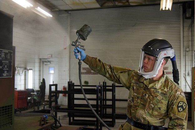 Staff Sgt. Joshua Tidwell repaints a generator getting it ready to go back out into the field. He works at the Volunteer Training Site in Smyrna, Tenn. (Photo by retired Sgt 1st Class Edgar Castro)