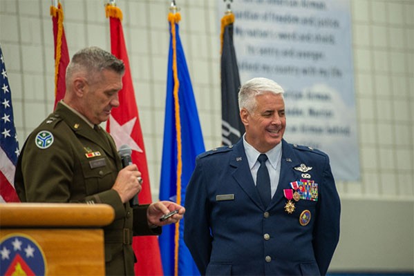 Maj. Gen. Jeff Holmes, Tennessee’s Adjutant General, presents Brig. Gen. Thomas Cauthen with an award during Cauthen’s retirement ceremony held at McGhee Tyson Air National Guard Base in Knoxville, Aug. 6. Cauthen retired from the Tennessee Air National Guard with 38 years of service to the state of Tennessee. (Air National Guard photo by Staff Sgt. Melissa Dearstone.) 
