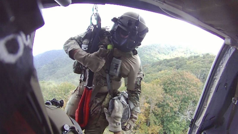 Sgt. 1st Class Giovanni DeZuani, a flight paramedic, is lowered from a UH-60 Blackhawk near Derrick Knob Shelter to rescue a hiker in distress along the Appalachian Trail, Sept. 20. The flight crew from the Tennessee National Guard conducted the emergency air evacuation mission after a hiker reported chest pains. (Courtesy photo from the Tennessee National Guard)