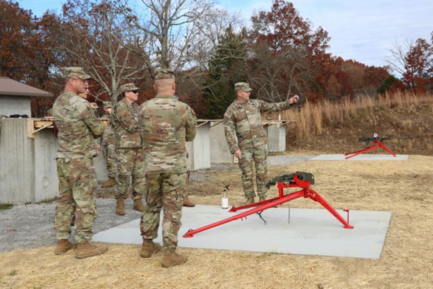 Maj. Timothy Butler, Volunteer Training Sites Program Manager, showcases a new .50-caliber Browning machine gun mount that his team developed to be able to fire the weapon on Tullahoma’s machine gun range. The Department of the Army and Air Force worked together with the Tennessee National Guard’s training site team to analyze the range, leading to the implementation of the new mount, which allows the .50-cal to be fired here in Tennessee for the first time ever. (photo by Sgt. 1st Class Timothy Cordeiro)