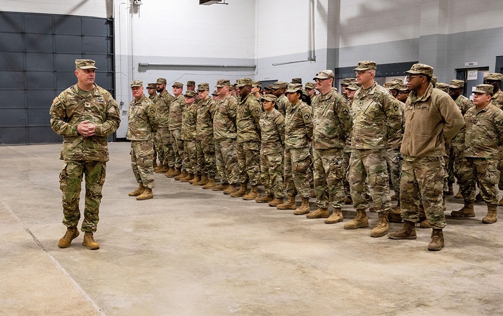 Col. Trent Scates, Tennessee’s Assistant Adjutant General, Army, talks with Soldiers from the 730th Composite Supply Company in Memphis, Feb. 4, as they prepare for their nine-month deployment to Kuwait. (photo by Senior Airman Travonna Hawkins) 