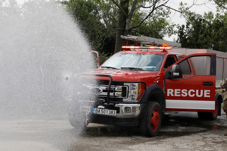 Tennessee Air National Guard firefighters and the Bulgarian Air Force firefighters test a fire truck after repairing a water pump on June 13 at Graf Air Base in Plovdiv, Bulgaria.