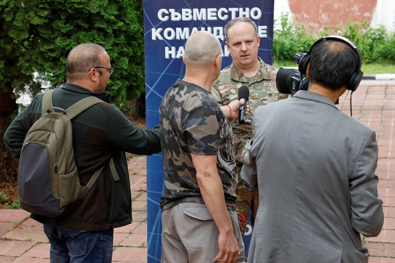 Col. Jay Jackson of the Tennessee Air National Guard conducts and interview with a local media outlet on June 14, outside Sofia, Bulgaria. (photo by Lt. Col. Marlin Malone) 