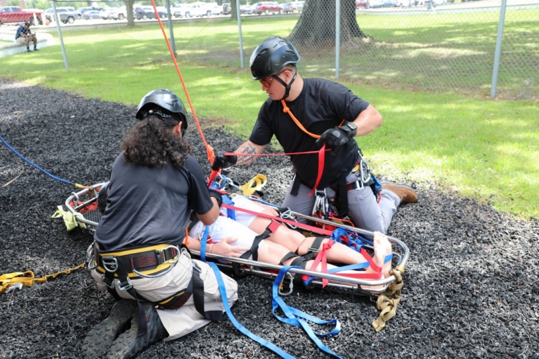 Sgt. 1st Class Jacinda Aguilera and Sgt. Joel Delarosa, both members of Smyrna’s 45th Civil Support Team, render aid to a simulated patient at Fort Whiting, Alabama, June 13, during a ropes rescue exercise. The 45th CST traveled to southern Alabama with other CSTs in the southeast region, from June 11-16, to sharpen their skillsets in a rapid response exercise. (U.S. Army National Guard photo by Sgt. 1st Class Timothy Cordeiro)