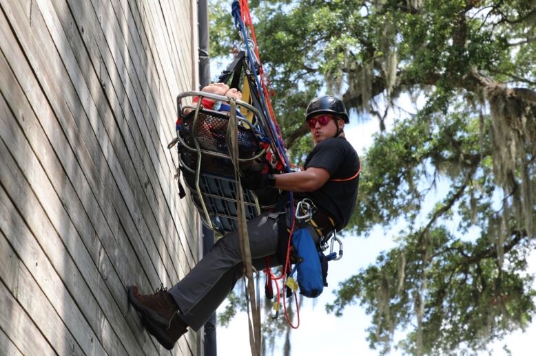 Sgt. Joel Delarosa, a member of Smyrna’s 45th Civil Support Team, is raised up a repel tower with a simulated patient at Fort Whiting, Alabama, June 13, during a ropes rescue exercise. The 45th CST traveled to southern Alabama with other CSTs in the southeast region, from June 11-16, to sharpen their skillsets in a rapid response exercise. (U.S. Army National Guard photo by Sgt. 1st Class Timothy Cordeiro)