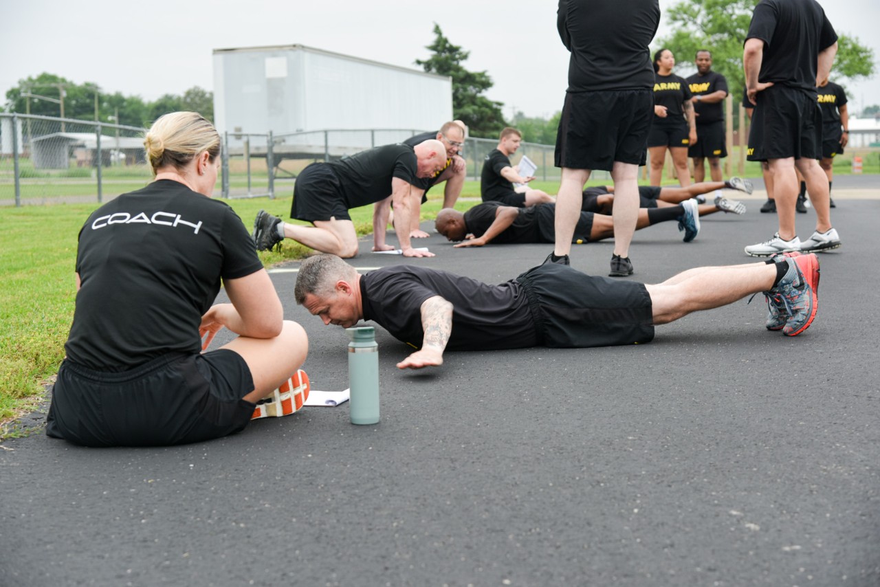 Soldiers in the GRIT program practice hand and release pushups. Soldiers in the GRIT program practice hand and release pushups.