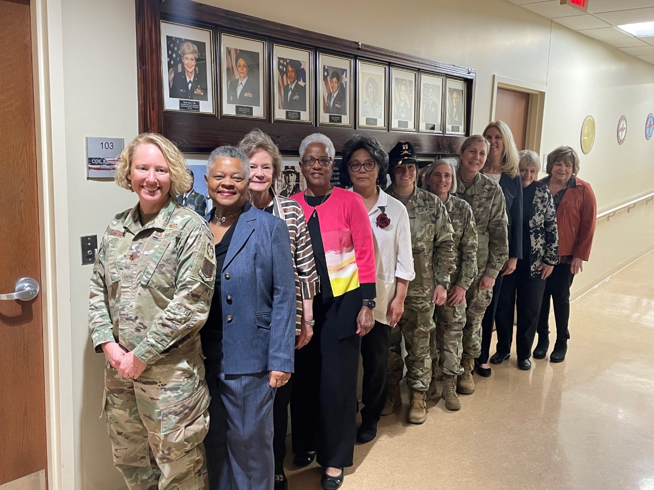 Current and former members of the Tennessee National Guard, who are featured on the new Women’s History Wall, pose in front of the memorial, March 28, following a ribbon-cutting ceremony that took place at Nashville’s Joint Force Headquarters. The wall features 23 women who were the first in their respective positions, such as first female Blackhawk pilot, and first female general officer of the Tennessee National Guard. (photo by Capt. Kealy Moriarty)