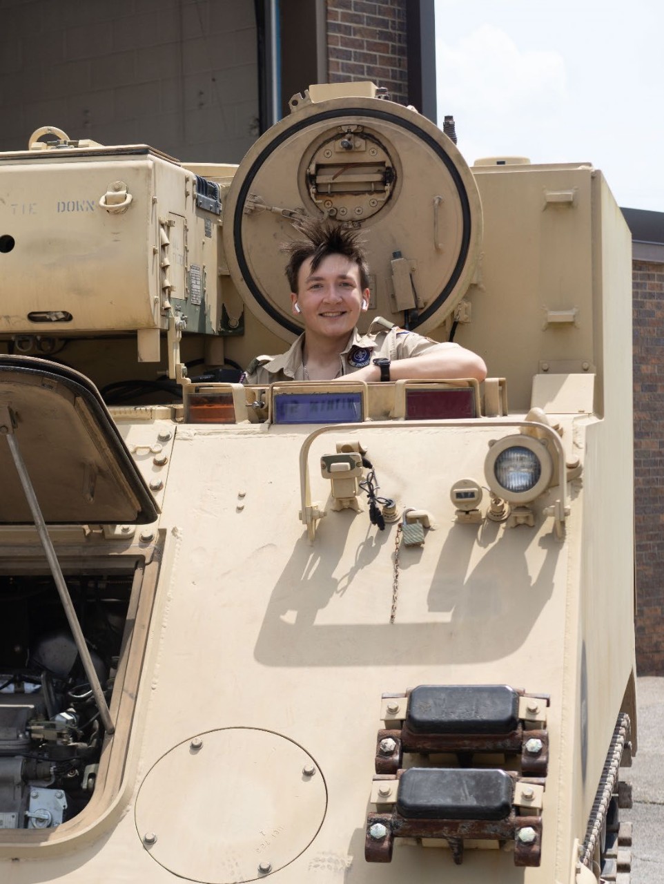 A scout from the Middle Tennessee Council explores an armored vehicle at the 3rd Annual Merit Badge University hosted by the Tennessee Military Department at Nashville’s Joint Force Headquarters, April 27. (photo by Staff Sgt. Matthew Brown)