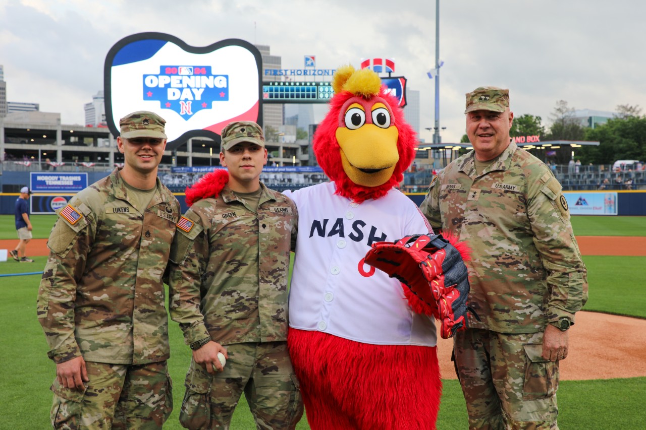 Staff Sgt. Cole Lukens, Tennessee National Guard Non-Commisioned Officer of the Year, Spc. Noah Green, Tennessee National Guard Soldier of the Year, and Maj. Gen. Warner Ross, Tennessee’s Adjutant General, pose with Nashville Sounds’ mascot Booster, prior to the Sounds’ game against the St. Paul Saints, April 2, at First Horizon Park in Nashville. The three guardsmen were recognized for the leadership and achievements prior to the game, with Green having the honor of throwing out the ceremonial first pitch. (photo by Sgt. 1st Class Timothy Cordeiro)