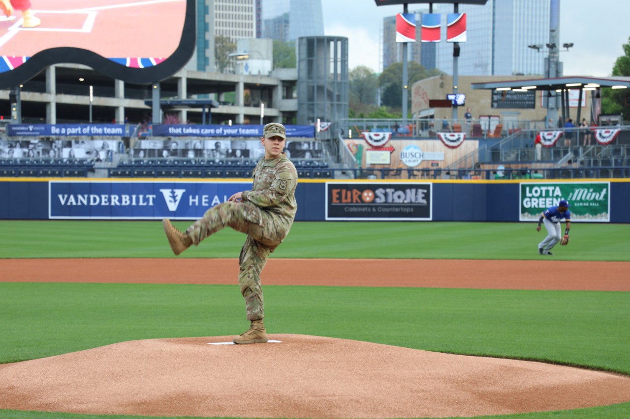 Spc. Noah Green, the Tennessee National Guard’s Soldier of the Year, threw out the ceremonial first pitch at Nashville’s First Horizon Park during the Sounds’ first home game of the season, April 2. Green, along with Tennessee’s Adjutant General, Maj. Gen. Warner Ross, and Staff Sgt. Cole Lukens, Tennessee’s Non-commissioned Officer of the Year, were honored before the game. (photo by Sgt. 1st Class Timothy Cordeiro)