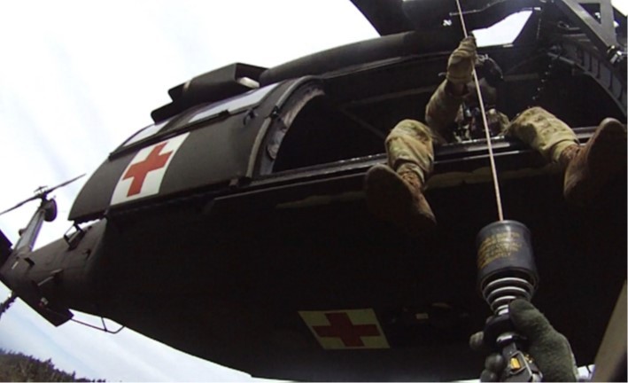 Tennessee Army National Guard Blackhawk helicopter crew chief, Sgt. Daniel Bandy, hoists flight paramedic, Sgt. 1st Class Giovanni DeZuani, into the aircraft after rescuing a hiker in respiratory distress in the Great Smoky Mountain National Park, at Mount LeConte Lodge, in the late afternoon of May 31. (submitted photo) Tennessee Army National Guard Blackhawk helicopter crew chief, Sgt. Daniel Bandy, hoists flight paramedic, Sgt. 1st Class Giovanni DeZuani, into the aircraft after rescuing a hiker in respiratory distress in the Great Smoky Mountain National Park, at Mount LeConte Lodge, in the late afternoon of May 31. (submitted photo)
