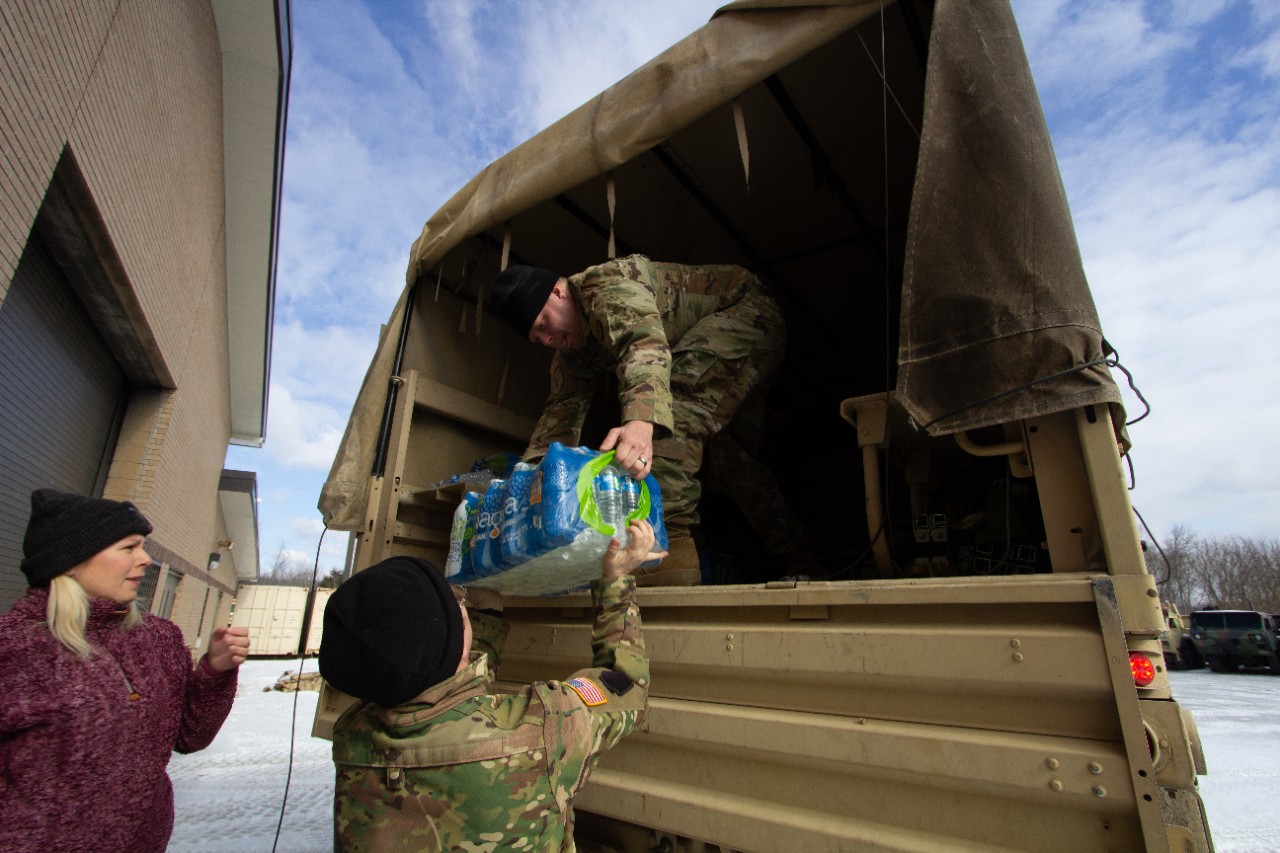 Soldiers with the 35th Division Sustainment Brigade transport and stage warming-center supplies inside the National Guard Armory in Perry County, February 1. Guardsmen helped establish a temporary warming center to support residents displaced and impacted by Winter Storm Fenn in coordination with local emergency management. (photo by Sgt. Maylee Curtis) Soldiers with the 35th Division Sustainment Brigade transport and stage warming-center supplies inside the National Guard Armory in Perry County, February 1. Guardsmen helped establish a temporary warming center to support residents displaced and impacted by Winter Storm Fenn in coordination with local emergency management. (photo by Sgt. Maylee Curtis)