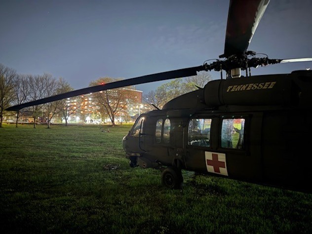 Tennessee Army National Guard UH-60 Blackhawk helicopter lands at Chattanooga’s Lincoln Park, next to Erlanger Baroness Hospital, where an injured hiker suffering severe lower extremity injuries following a rockslide near Signal Mountain was transferred to an awaiting ambulance and taken to the hospital emergency room, March 21. (submitted photo)    