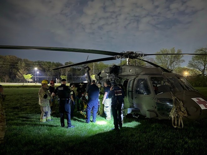 Tennessee Army National Guard flight crew and rescue personnel transfer an injured hiker suffering severe lower extremity injuries, following a rockslide near Signal Mountain, from a Tennessee Army National Guard UH-60 Blackhawk to an awaiting ambulance at Chattanooga’s Lincoln Park, next to Erlanger Baroness Hospital, March 21. (submitted photo)    