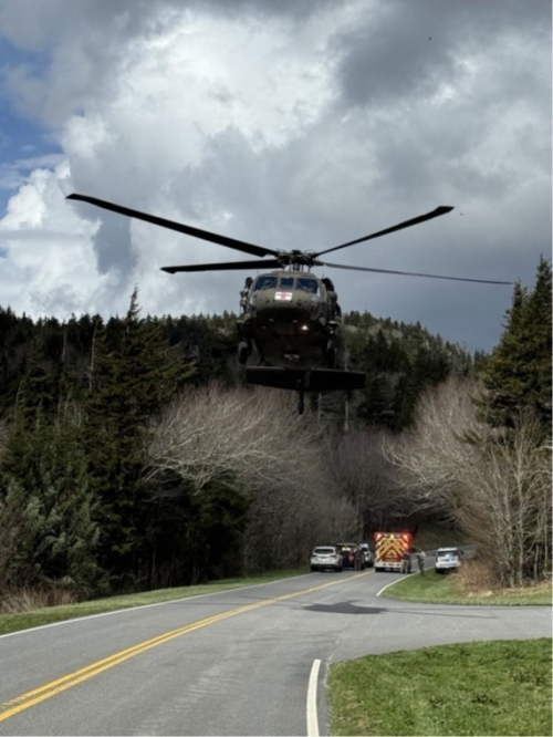 A Tennessee Army National Guard UH-60 Blackhawk lifts off from the Dillons Gap parking lot along Kuwohi Road, in the Great Smoky Mountain National Park, to airlift a park visitor suffering cardiac arrest to the University of Tennessee Medical Center in Knoxville, April 1. (submitted photo)    
