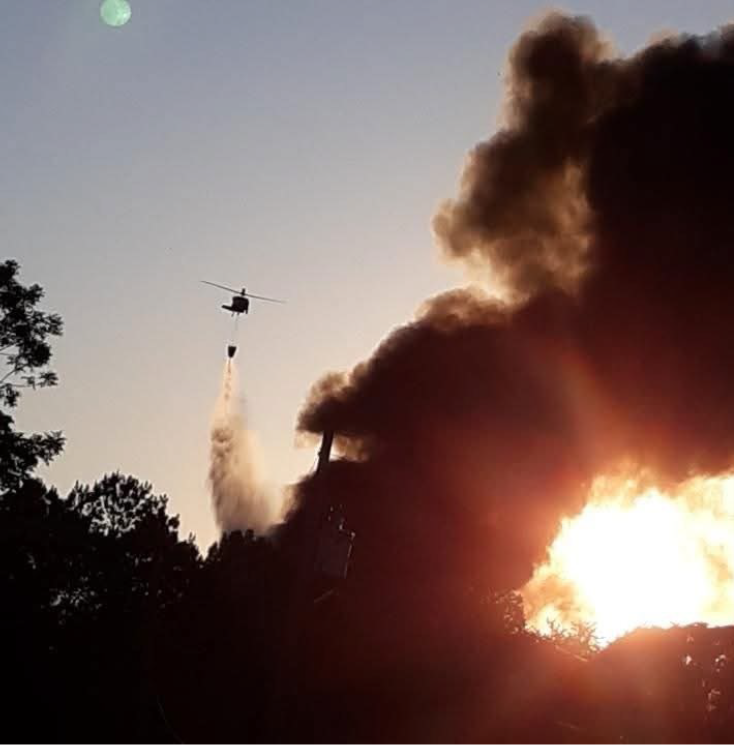 At the request of the Tennessee Emergency Management Agency, a Tennessee Army National Guard UH-60V Blackhawk helicopter with the 1-230th Assault Helicopter Battalion, based in Jackson, supported firefighters battling an industrial fire at the Sigma Renew 360 plant in Henry County, May 8. (Courtesy Photo) At the request of the Tennessee Emergency Management Agency, a Tennessee Army National Guard UH-60V Blackhawk helicopter with the 1-230th Assault Helicopter Battalion, based in Jackson, supported firefighters battling an industrial fire at the Sigma Renew 360 plant in Henry County, May 8. (Courtesy Photo)