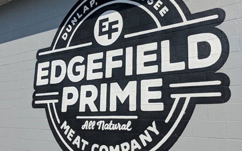 Large painted wall logo reads “Edgefield Prime All Natural Meat Company.”