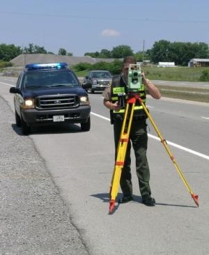 Trooper with camera on side of road