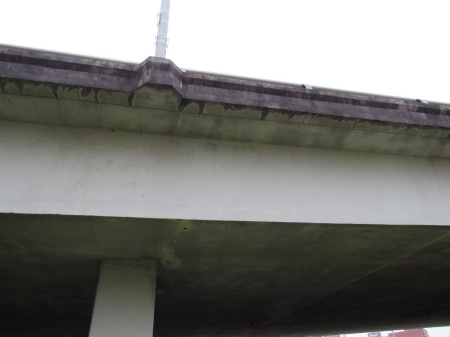 bridge inspection photo showing hairline cracks in concrete
