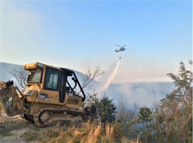 helicopter helping cool fire in advance of dozer helicopter helping cool fire in advance of dozer