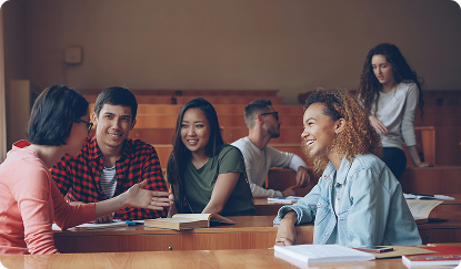 Photo of students talking in a classroom