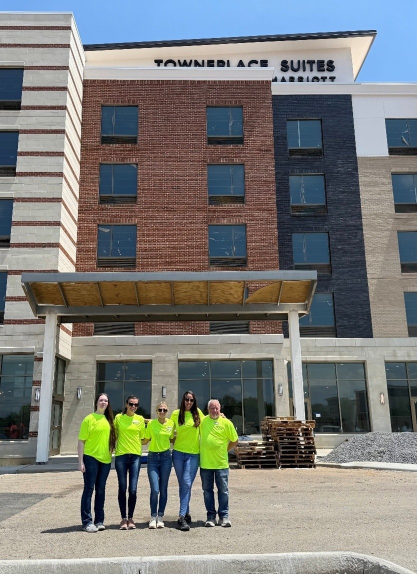 Photo of team standing in front of TownePlace Suites Murfreesboro