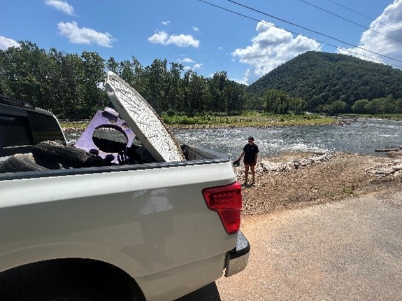 Photo from Wahoo’s Adventures of a person and a truck by a river